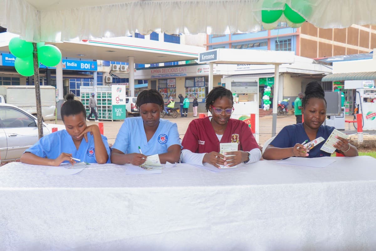 Axcess clinicians reviewing patient records at an outreach desk